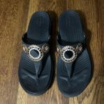Crocs  Sanrah Diamante Wedge Flip sandals are a size 9. Photo 1