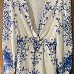 Lovers + Friends  Blue and White Floral Long Sleeve romper Photo 0