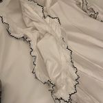 Pure Nordic | White Blouse Cold Shoulder Cutouts Pom Poms Black Stitching XS Photo 5