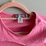 Urban Outfitters  pink cutout crop top Photo 1