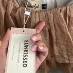 sunkissed Gold/tan ruffle romper Photo 3