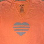 Adidas orange short sleeve T-Shirt with heart, size Small Photo 1