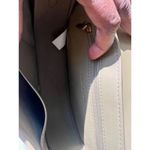 Charles and Keith ’s signature Gabine leather saddle bag Photo 3