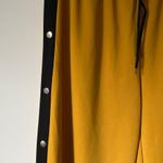 tear away yellow track pants Size 10 Photo 1