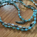 Alexa's Angel's‎ wing String Blue Photo 1