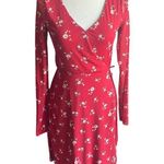 Hollister -RED FLORAL DRESS-SIZE XS Gorgeous red floral faux wrap dress, long sleeves,v neck had hook closure, dress is fully lined, semi sheer sleeves, elastic waist, excellent condition Measurements: Bust: armpit to armpit 16 inches Waist: side to side 12-15 inches Length: shoulder seam to bottom 36 1/2 inches Photo 0