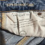 American Eagle  Outfitters Distressed Flare Jeans in Blue Photo 4