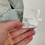 Club Monaco  Ruffle Bottom Long Sleeve Chambray Top Size Xsmall Photo 4