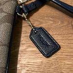 Coach  Tan and Black Wristlet with Gold Accents Photo 1