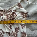 No Comment Chic White Maxi Dress with Brown Floral Design Photo 9