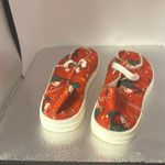Red Santa sneakers. Their canvas size European 38,which converts to a size 7 1/2 Photo 2