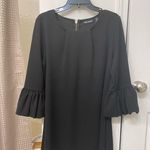 Gorgeous black dress with puff sleeves. Size Medium. Zipper on back. Photo 0