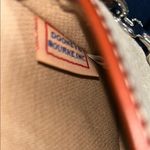 Dooney & Bourke  Cream and Brown Clutch with Vintage-Inspired Design Photo 3