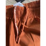 Alphalete  Woman’s Infinity Stride Short W/ Liner - Sour Tangerine, Size Small Photo 8