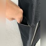 Athleta  Criss Cross Drifter Legging Size XS Gray Black Zip Pockets Photo 5