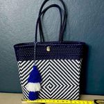 Blue and White Geometric Tote Bag with Tassel Accent Photo 0