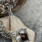 Boutique Tigers Eye stone in a heart shaped necklace cage. 36”chain Photo 7