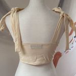 Cider  bandeau.  Size Small. Zip closure on side. Straps tie into bows. Photo 2