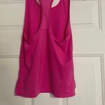 Under Armour sleeveless workout tank is a size XS. Photo 1