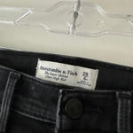 Abercrombie & Fitch The Super Skinny Ultra High Rise Black Distressed Hem Jeans Photo 2