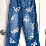 Source Unknown Butterfly blue jeans Photo 0