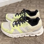 on cloud On Running women’s white sneakers with dark grey laces and neon yellow details Photo 5
