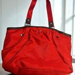 Baggallini Red/Orange Nylon Travel Tote Bag With Brown Accents & Multiple Compartments Photo 0