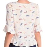 Elodie  Cream Peplum Bell Sleeve Eyeglasses Motif Blouse Size L Photo 2