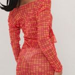 EGO LONG SLEEVE KNOTTED CUT OUT DETAIL MINI BODYCON DRESS IN PINK SPOTTY MESH Photo 2