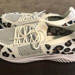 NWOT Step out in style with these chic white and black brown women's sneakers. Perfect for casual outings, these shoes offer both comfort and fashion. Size 10.5 never worn. Multiple Photo 0