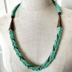 Green and brass tone long seed beaded necklace Photo 0