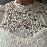 Mystic White lace dress with open back. Photo 6