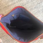 Charming Charlie red and blue clutch with tassel Photo 7