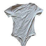 House of Harlow NWT Women's Cream Thong Short Sleeve Bodysuit Size Medium Photo 1