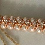 Glamwrist Bands made with light pink pearls and sparkling crystal details. Photo 0