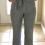 BCBGeneration  stripped Flared leg jumpsuit size 4 women's fits like a 2 … Photo 0