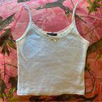 Brandy Melville white lace trim eyelet pointelle bow camisole tank top Photo 0