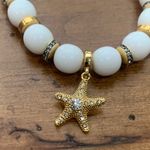 Juicy Couture  Stretch White Beaded Charm Bracelet with Dangling Starfish Charm Photo 4