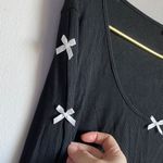 Chic Black Long Sleeve Top with White Bow Details Size M Photo 3