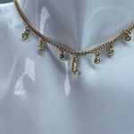 White House | Black Market WHBM “L” dangle rhinestone gold colored choker . Photo 1