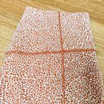 Athleta  Leggings Salutation Stash II Textured Tight Orange White Leopard Length Photo 3