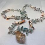 Beautiful women sea shell necklace with pearl beads, featuring a white and blue design. Multiple Photo 2