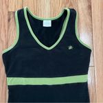 Nanette Lepore So Sporty a brand under . It features a black body with green trim Photo 1