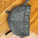 Gray studded faux leather cross body bag. Magnetic snaps on the front. Photo 5