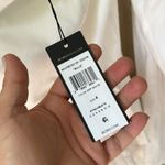 BCBGMAXAZRIA White romper  NEW off the shoulder flare arm peplum tiered detail Photo 1