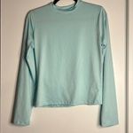 Very light weight light blue long sleeve round neck shirt Size M Photo 0