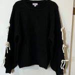 Elegant Black Sweater with White Bow Accents Size M Photo 0