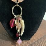 Pink beaded charm necklace with stone horn of wealth and silver tone accents Photo 1