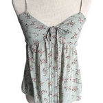 American Eagle Outfitters-Green floral top-size medium Super cute floral top, side cut outs, smocked back, adjustable straps, excellent condition Measurements: Bust: armpit to armpit 17-19 inches Length: shoulder seam to bottom 21 inches Photo 0