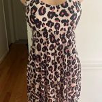 Generic Stylish leopard print swim dress with black underlay. Perfect for beach outings. Photo 1